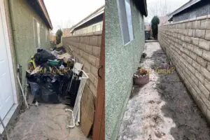 Mattress removal in Rosamond, CA ? before and after showing stripped-down bedroom area cleared of old mattress and debris.