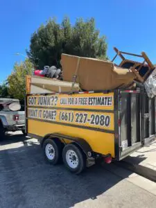 Furniture and couch disposal loaded for removal in Littlerock, California.