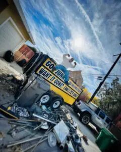 Junk removal trailer loaded with metal scrap and yard debris in Palmdale, CA.